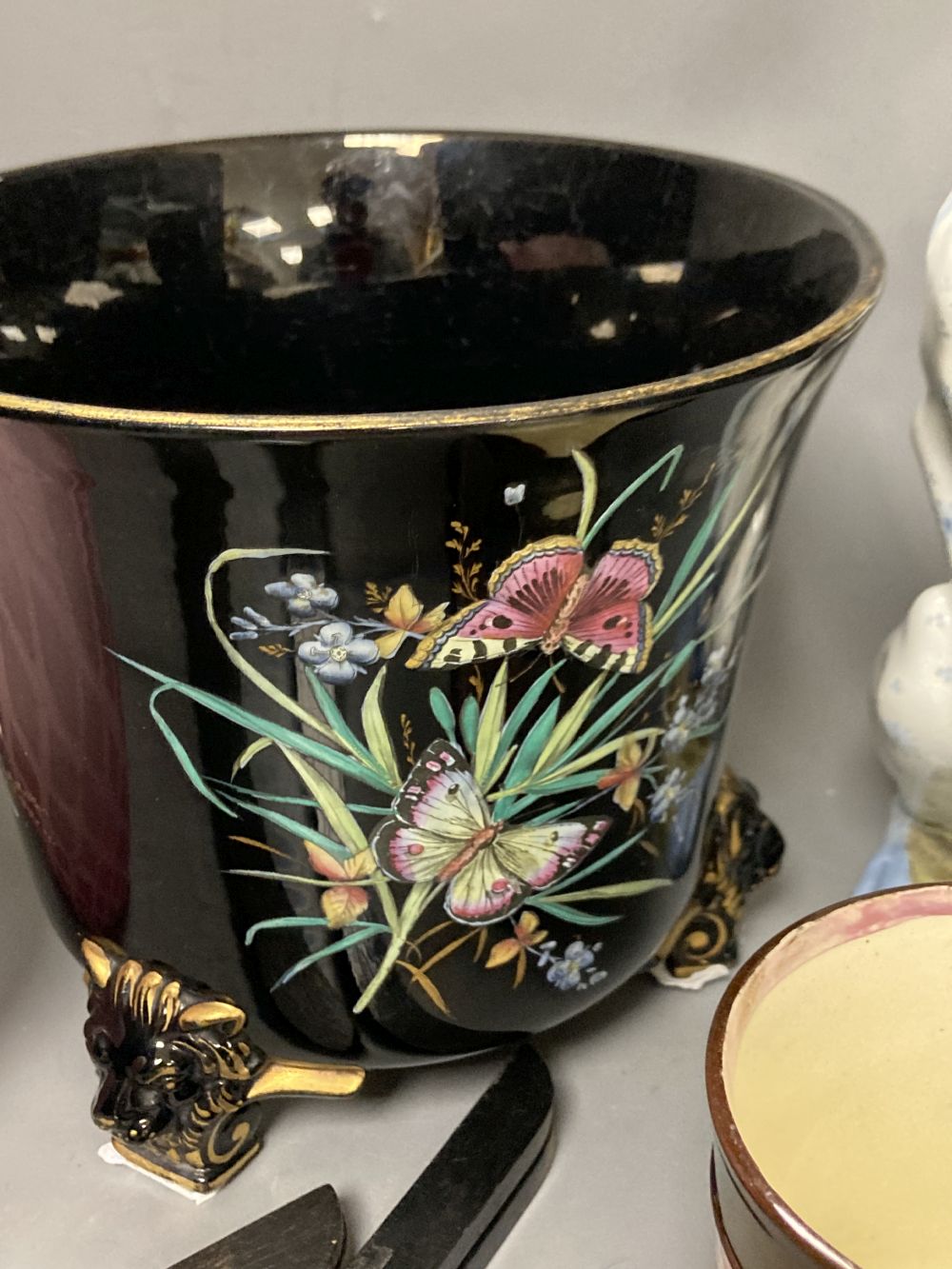 An opaline glass jug, an Edwardian jardiniere, a lustre mug and a novely whippet jug, 29cm